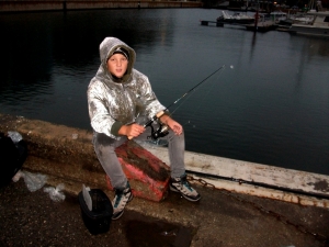 A young fisherman in Tallinn's seaport